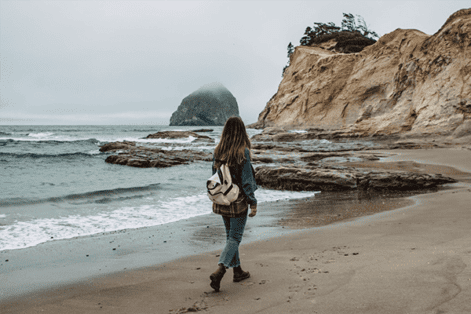 Woman walking on Pacific City Beach